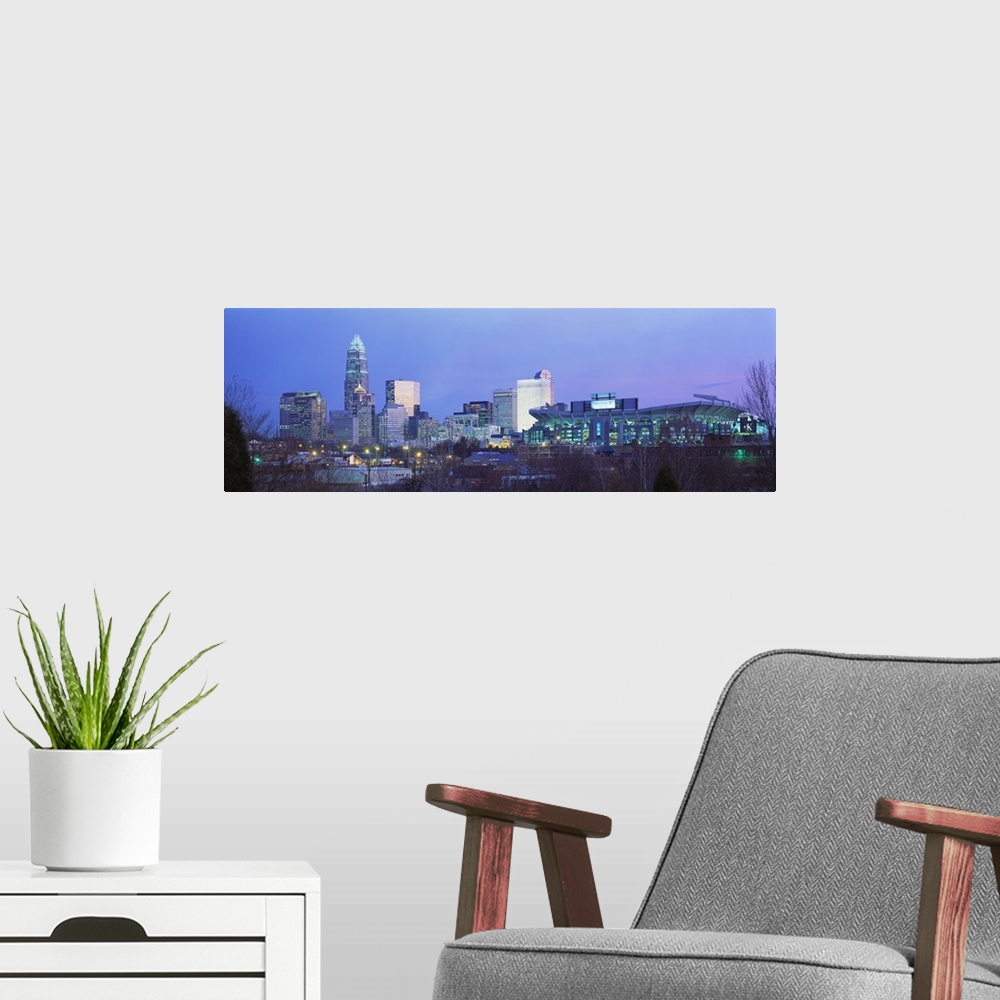 A modern room featuring Downtown skyline of Charlotte, North Carolina, featuring the Ericsson Stadium. This photograph wa...