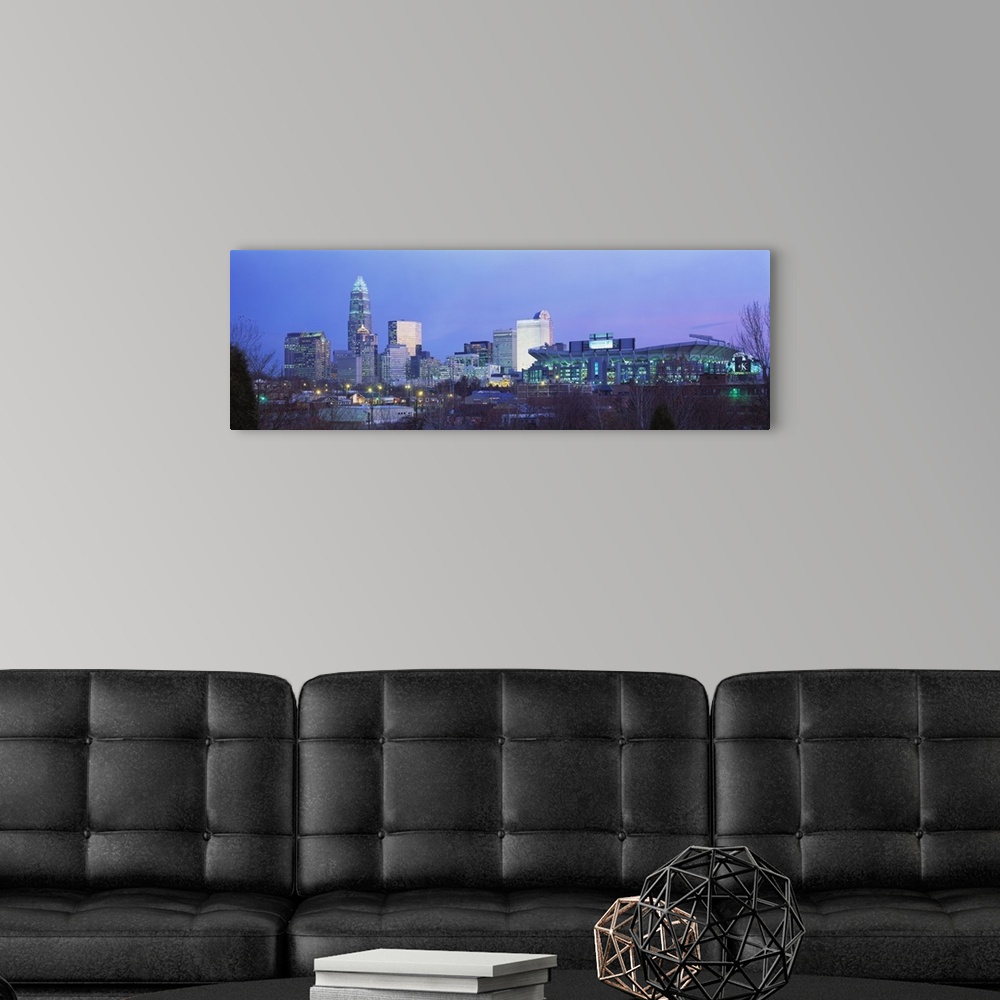 A modern room featuring Downtown skyline of Charlotte, North Carolina, featuring the Ericsson Stadium. This photograph wa...