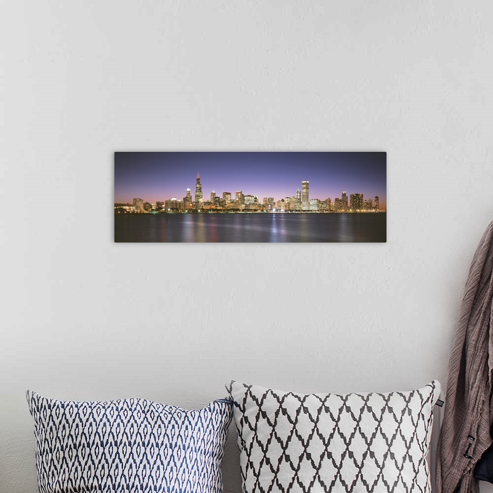A bohemian room featuring Panoramic photograph composed of the busy skyline of this landmark city in Illinois.  The blurred...