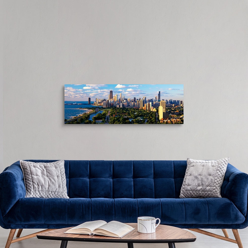 A modern room featuring Panoramic photograph taken of the busy skyline of Chicago, Illinois on a sunny day.  The skyscrap...