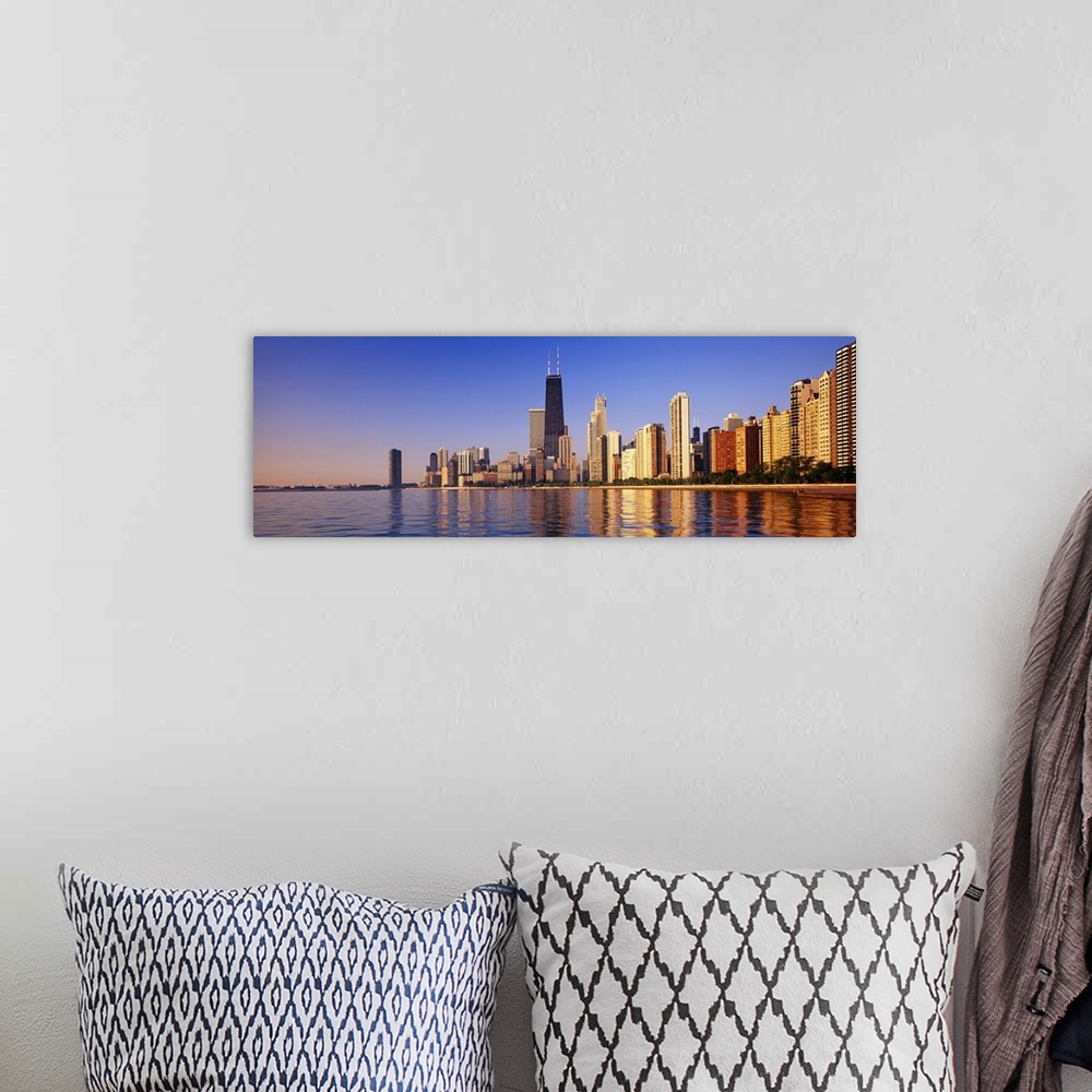 A bohemian room featuring Large panoramic view taken from the water of the Chicago skyline with the sears tower highlighted...