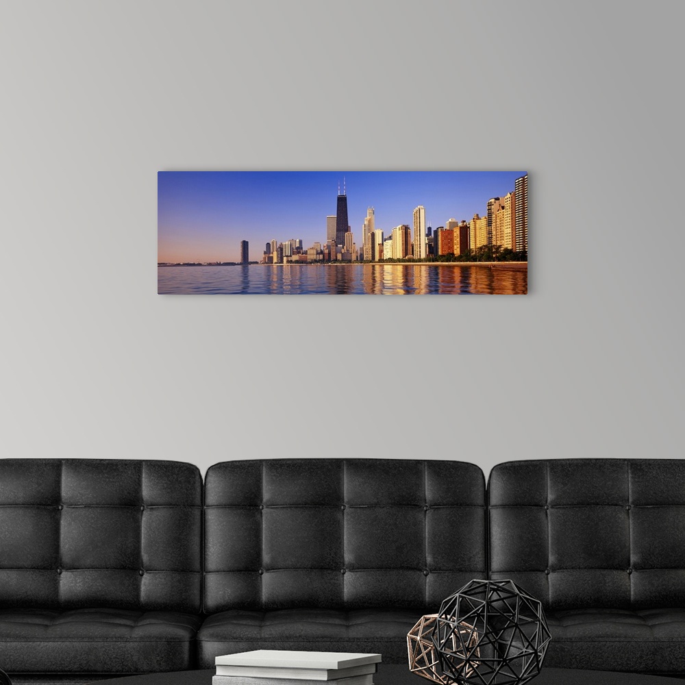 A modern room featuring Large panoramic view taken from the water of the Chicago skyline with the sears tower highlighted...