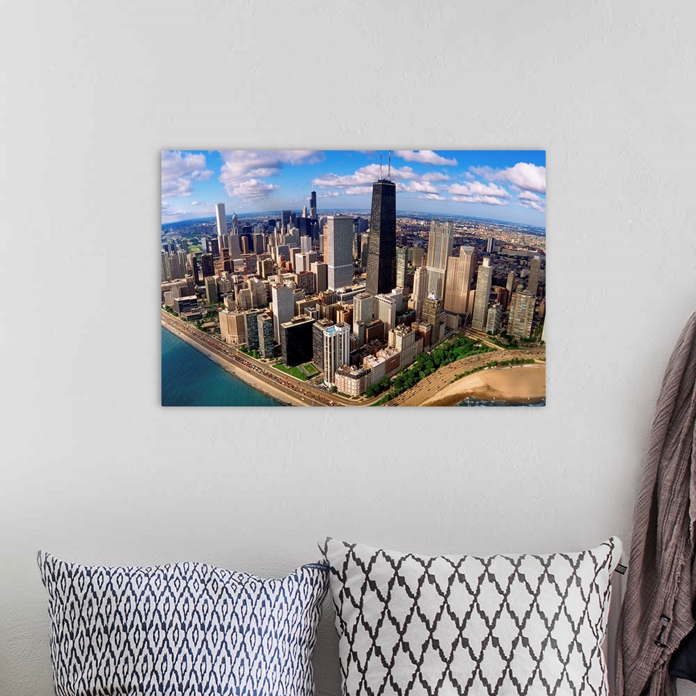 A bohemian room featuring A high angle landscape photograph viewing downtown Chicago taken from over Lake Michigan.