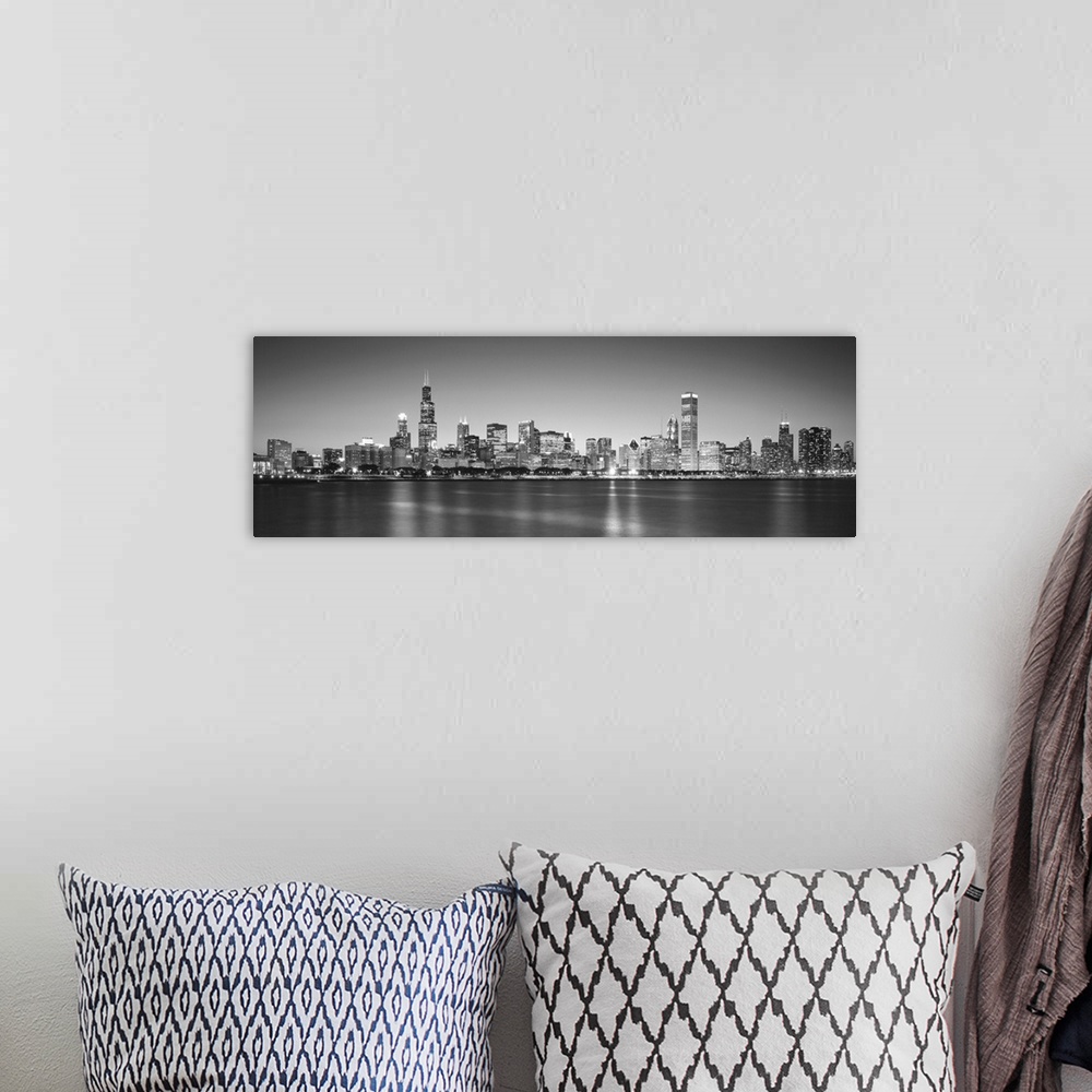 A bohemian room featuring Panoramic monochromatic photograph showcases the busy skyline of a famous city within the Midwest...