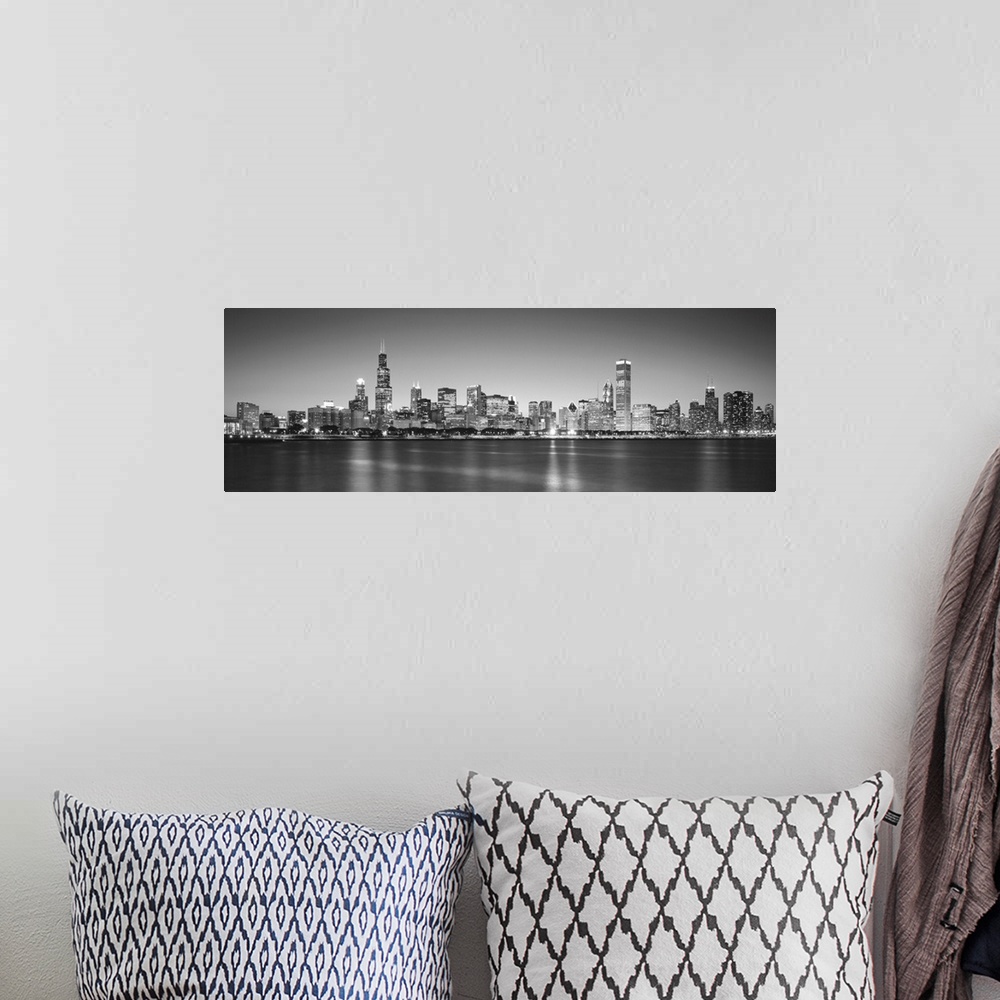 A bohemian room featuring Panoramic monochromatic photograph showcases the busy skyline of a famous city within the Midwest...