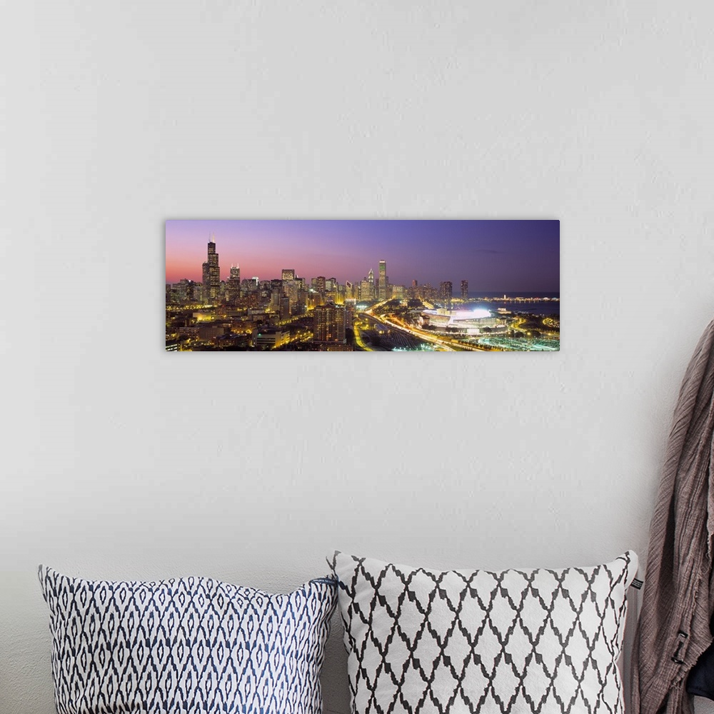 A bohemian room featuring Panoramic photograph captures the intensely bright lights of the busy streets and skyscrapers tha...