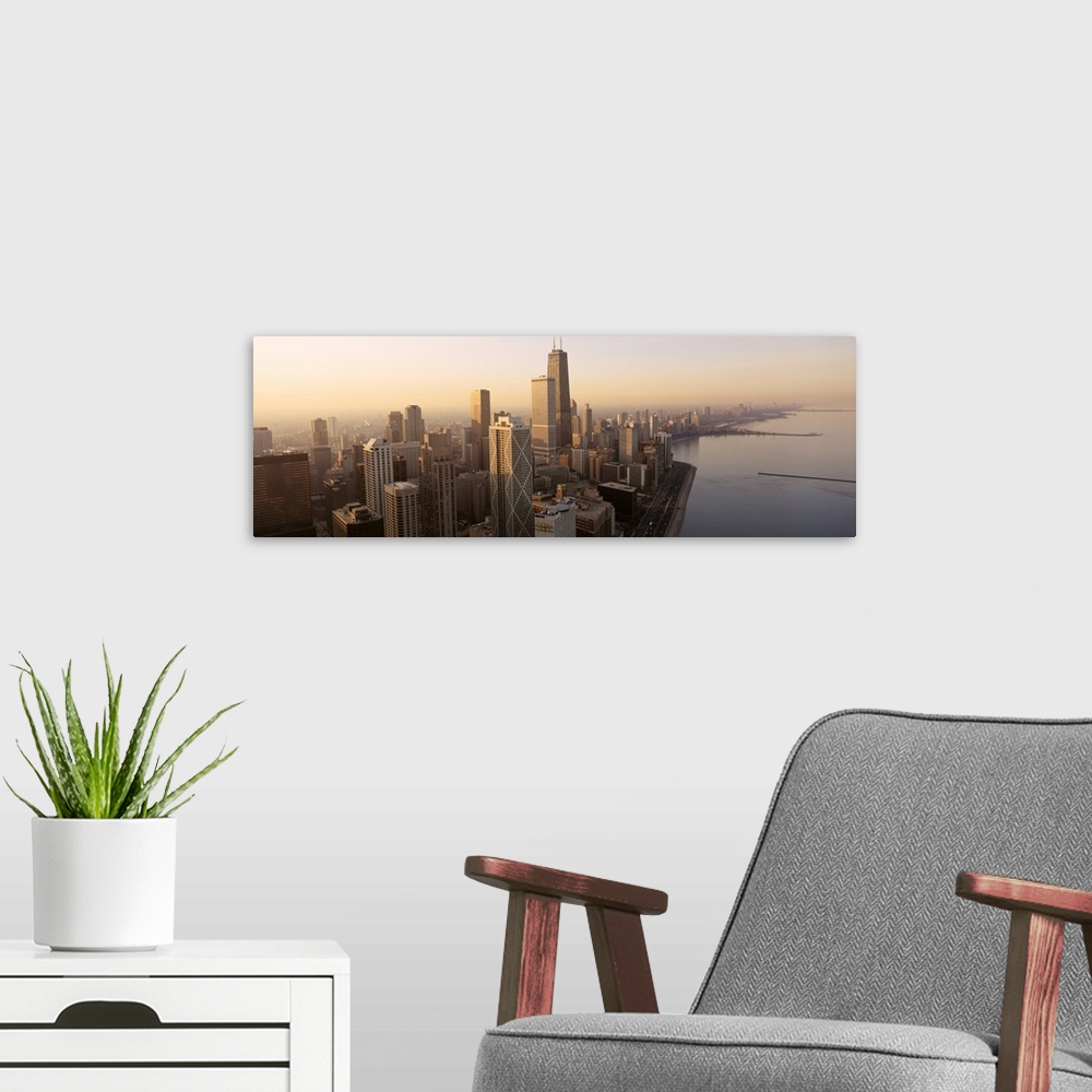 A modern room featuring High angle panoramic photograph taken of the skyscrapers in Chicago during sunrise with the lake ...