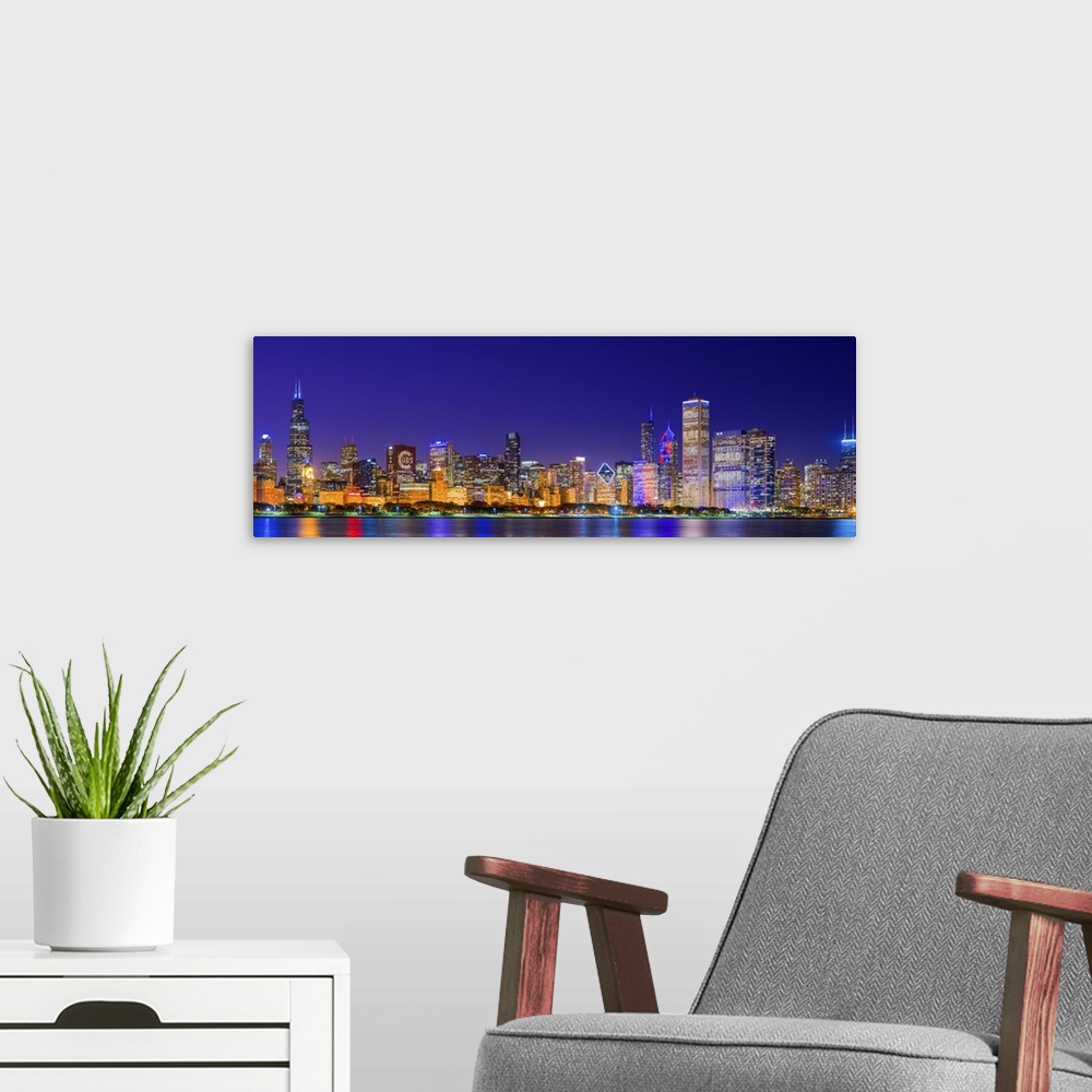 A modern room featuring Chicago skyline with Cubs World Series lights night, Lake Michigan, Chicago, Cook County, Illinoi...