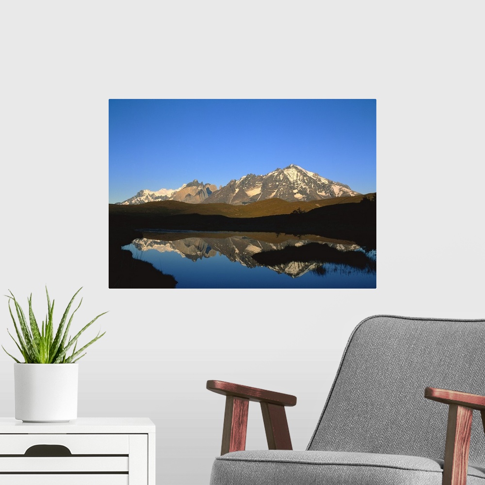 A modern room featuring Chile, Torres Del Paine National Park, Panoramic view of a mountain range around a lake