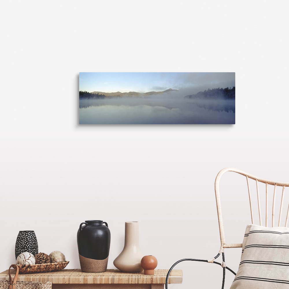 A farmhouse room featuring Wall art for the home or office this panoramic photograph shows mist rising off a New England lake.