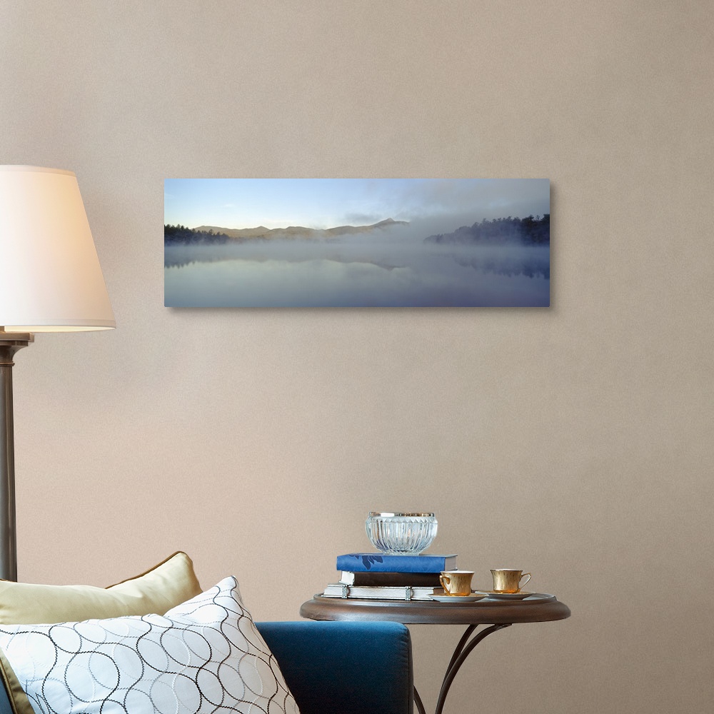A traditional room featuring Wall art for the home or office this panoramic photograph shows mist rising off a New England lake.