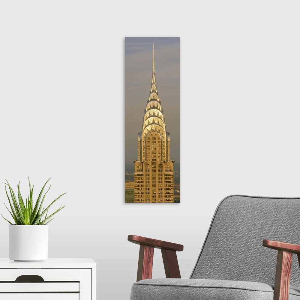 A modern room featuring Closeup photograph of the top of the Chrysler Building shining in the sun in New York City, NY (N...