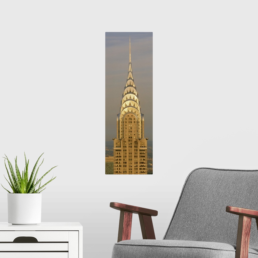 A modern room featuring Closeup photograph of the top of the Chrysler Building shining in the sun in New York City, NY (N...