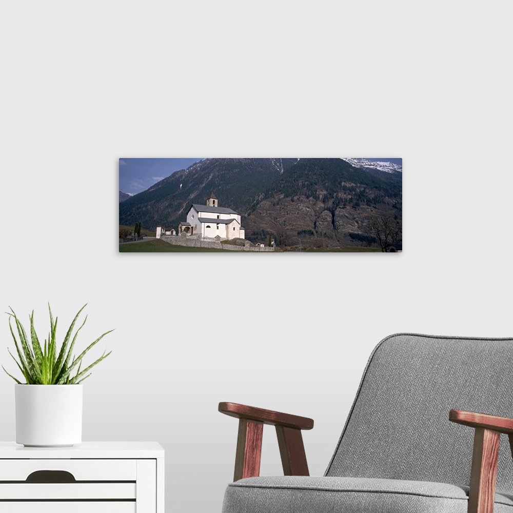 A modern room featuring Church in front of a mountain, Blenio Valley, Ticino, Switzerland
