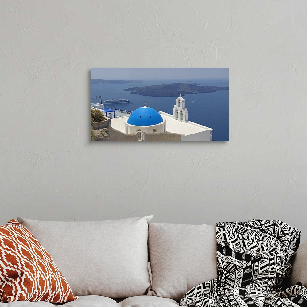 A bohemian room featuring Church overlooking a sea, Aegean Sea, Santorini, Cyclades Islands, Greece