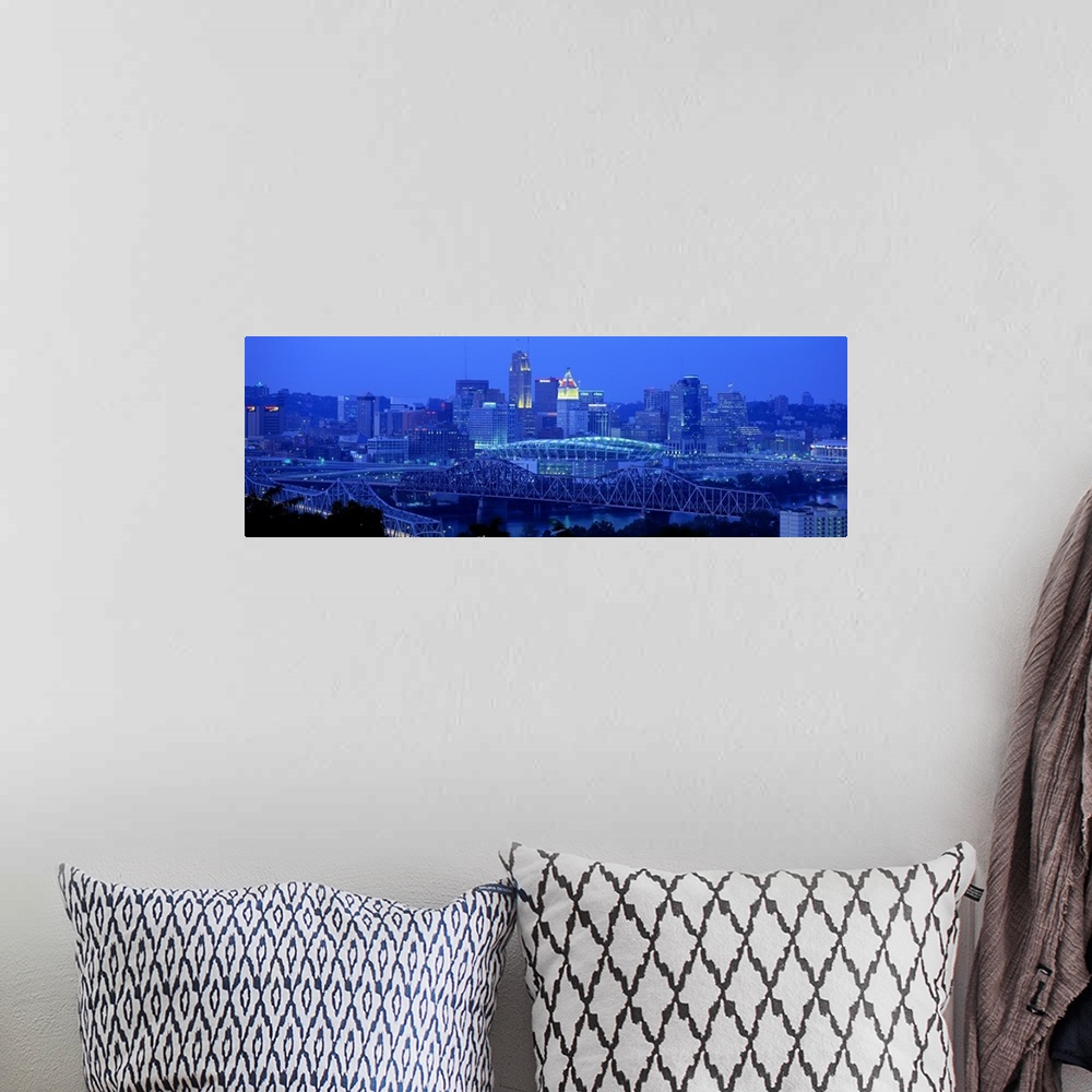 A bohemian room featuring Panoramic photograph of downtown  Cincinnati skyline at night and bridges over the Ohio River.
