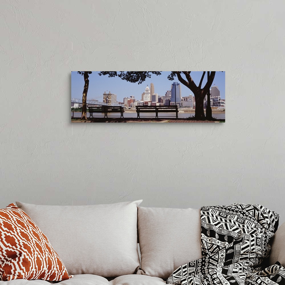 A bohemian room featuring Giant, wide angle photograph of two park benches looking toward the Cincinnati skyline in Ohio.