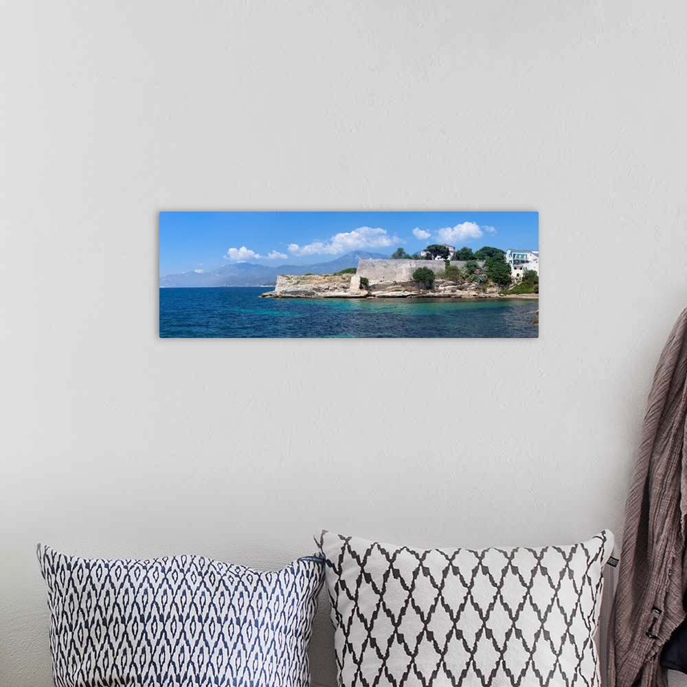 A bohemian room featuring Citadel at the waterfront, Saint-Florent, Haute-Corse, Corsica, France