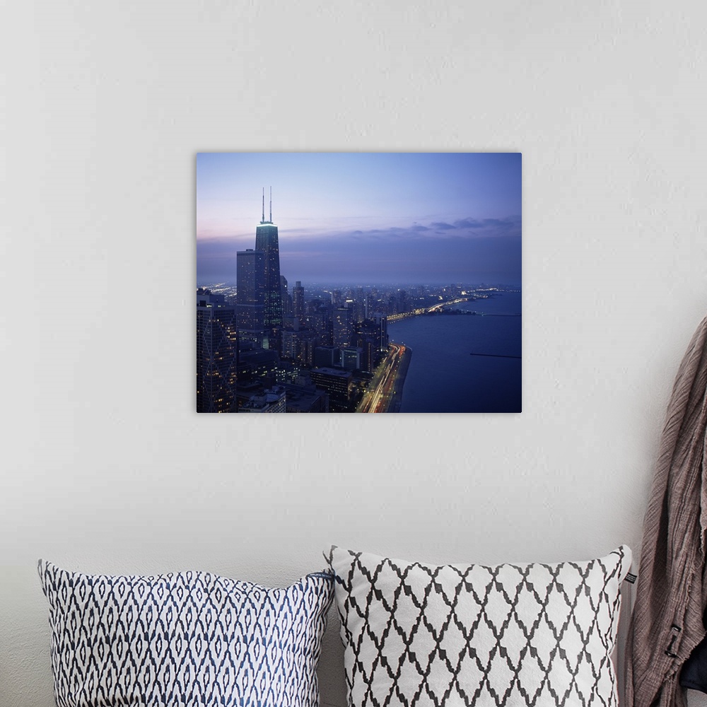 A bohemian room featuring This large piece is a photograph taken of Chicago during dusk showing the busy city to the left a...