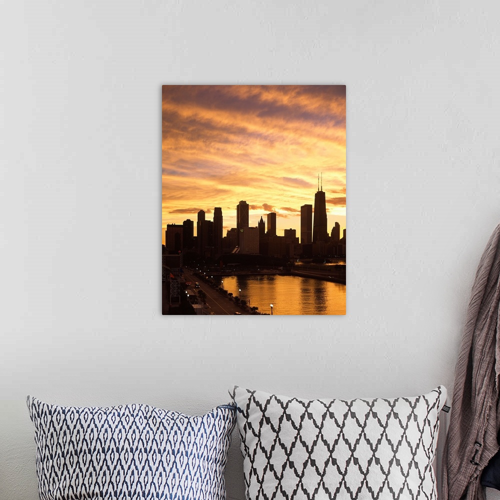 A bohemian room featuring Giant, vertical photograph of the Chicago skyline and Navy Pier beneath a golden sky of wispy clo...