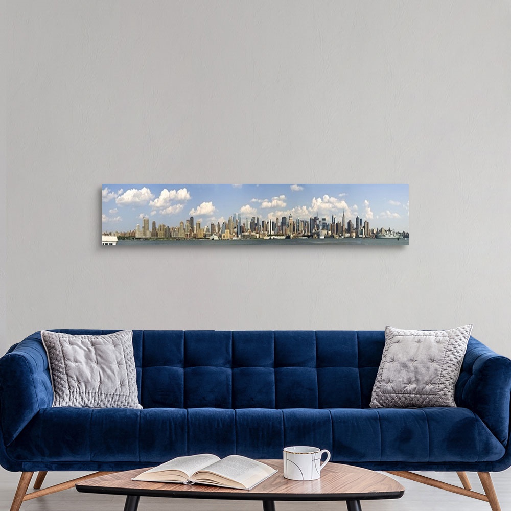 A modern room featuring Panoramic of the New York City Skyline on a bright sunny day.