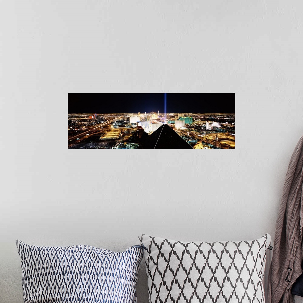 A bohemian room featuring Giant, wide angle landscape photograph of Las Vegas at night, taken looking downward from Mandala...
