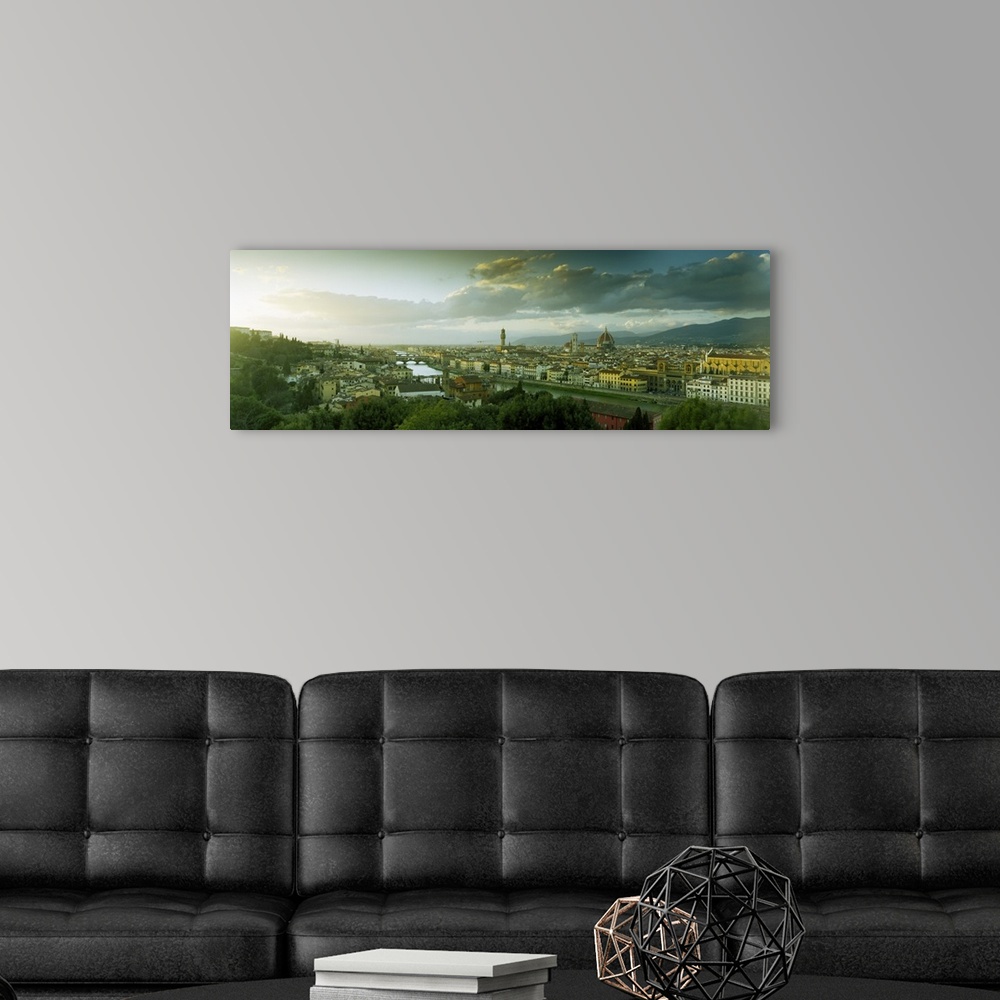 A modern room featuring Panoramic photograph taken from an aerial view overlooking a busy city within Europe.  In the dis...