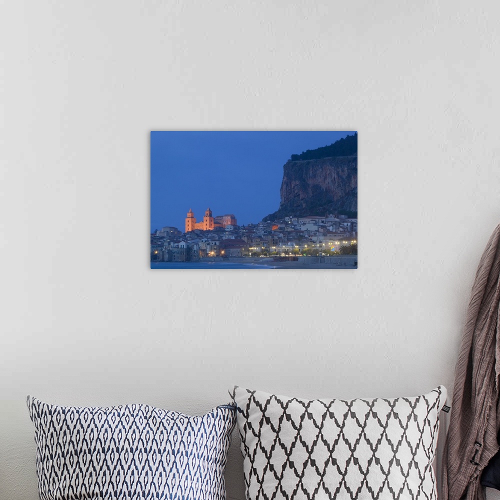 A bohemian room featuring Large photograph includes a lively town on the coast of this famous island in Europe brightly shi...