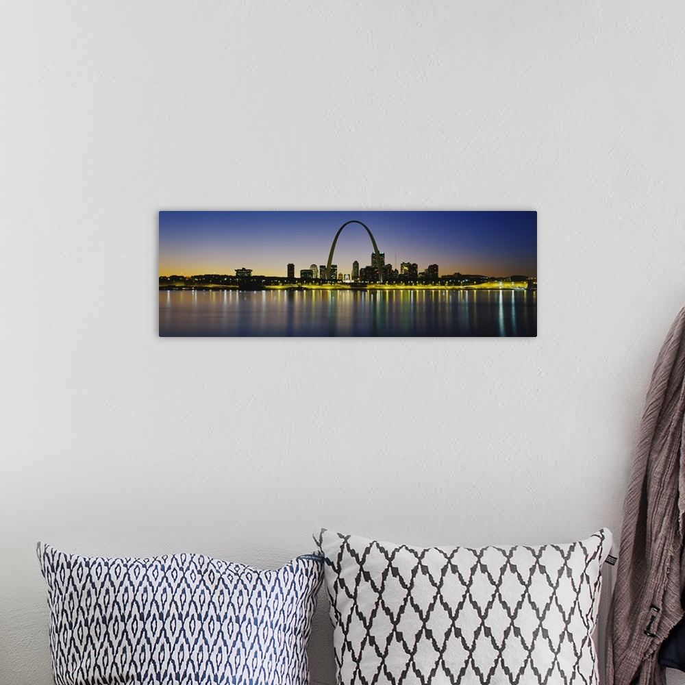 A bohemian room featuring Panoramic photograph of skyline featuring the St. Louis Arch and waterfront at dusk.