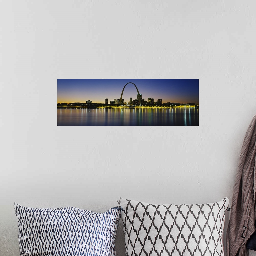 A bohemian room featuring Panoramic photograph of skyline featuring the St. Louis Arch and waterfront at dusk.