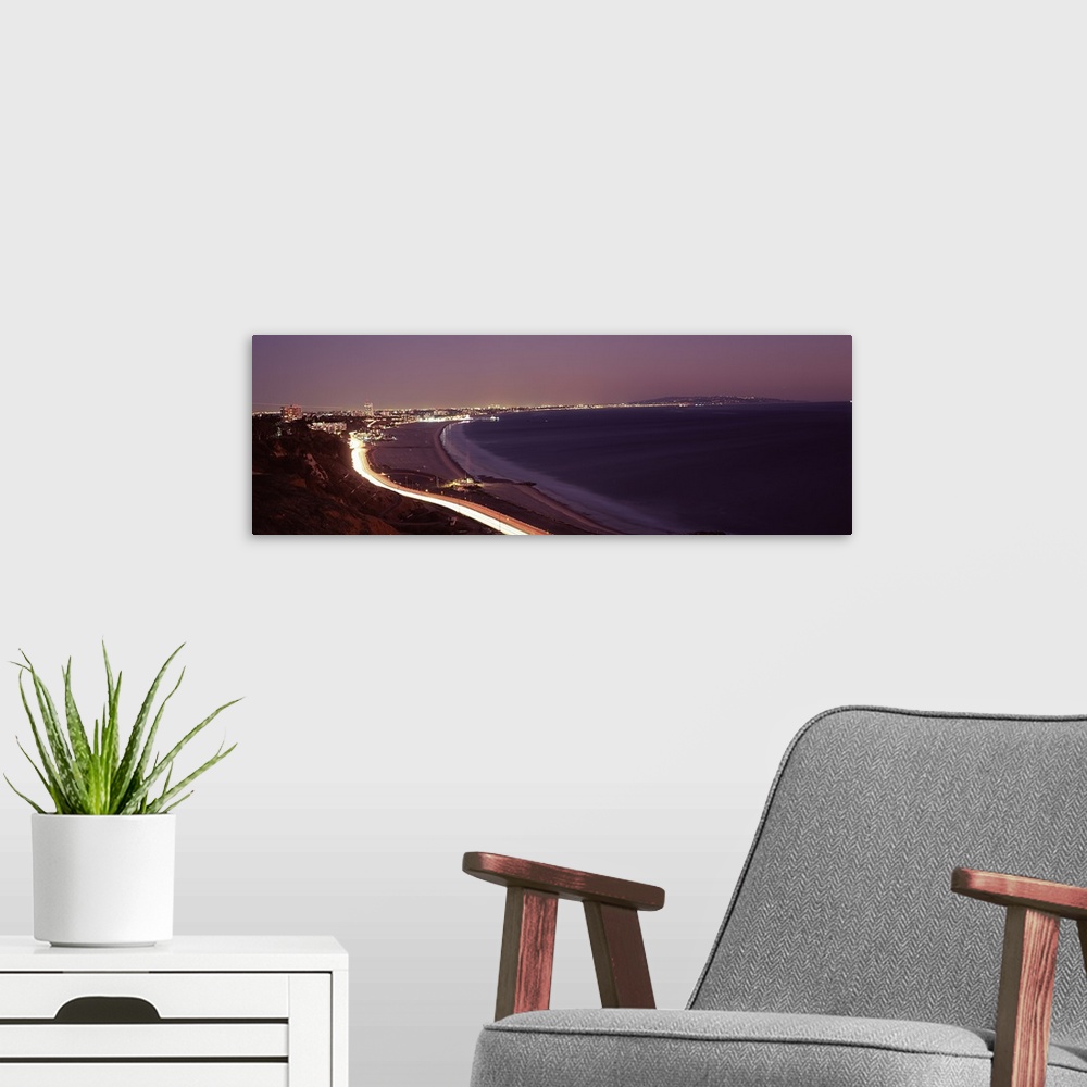 A modern room featuring City lit up at night, Highway 101, Santa Monica, Los Angeles County, California, USA