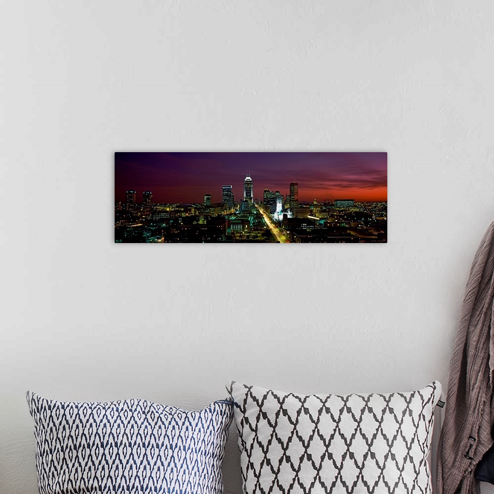 A bohemian room featuring A cityscape panoramic of captured in the fading evening light in this photograph.