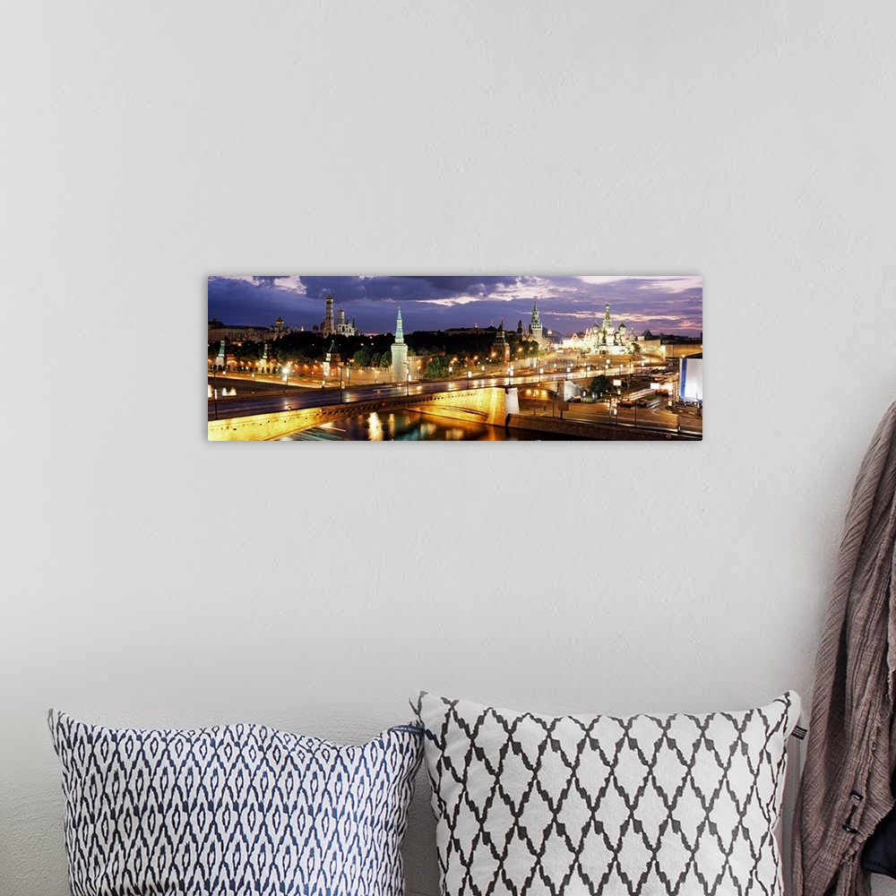 A bohemian room featuring Panoramic photograph of skyline and waterways at dusk under a dark cloudy sky.