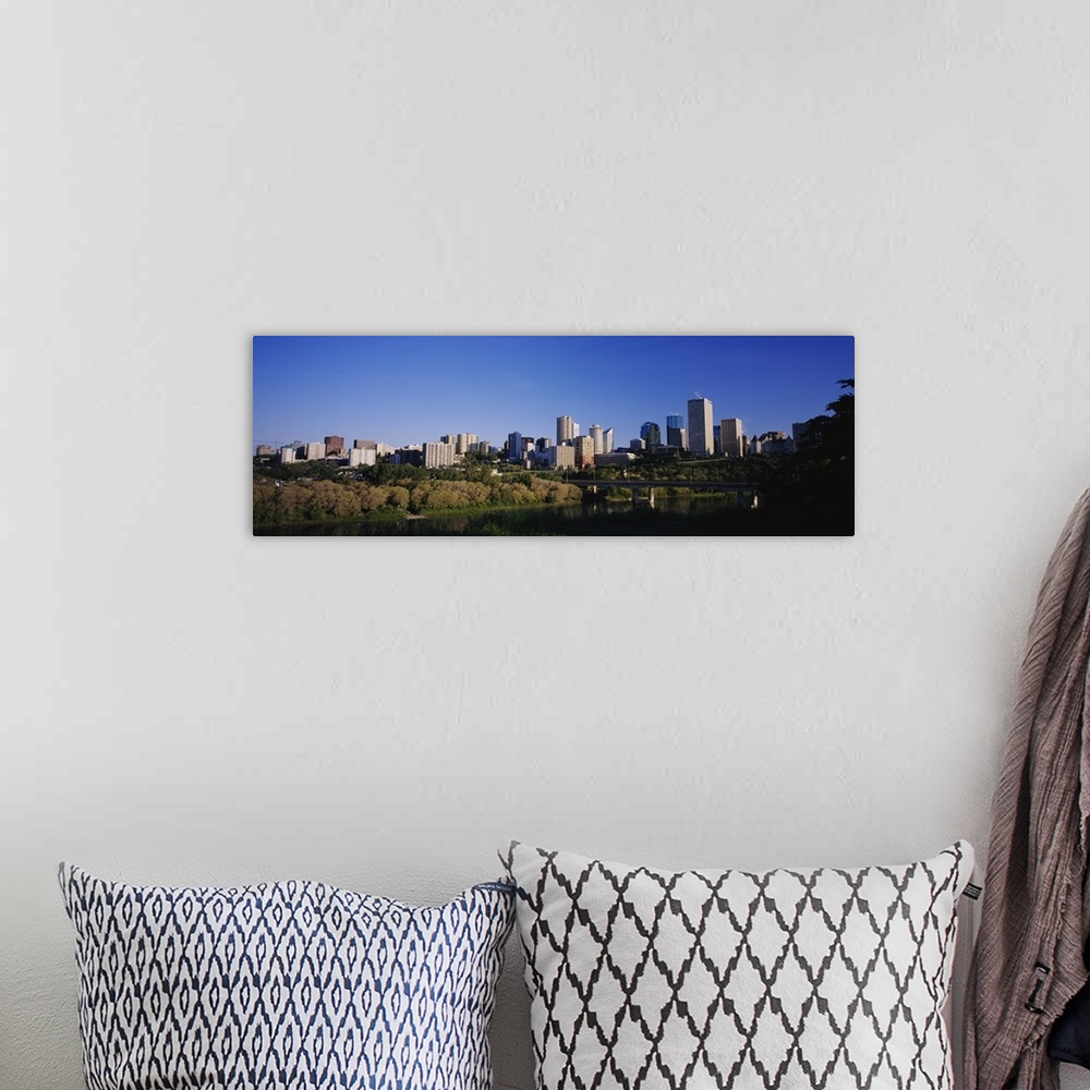 A bohemian room featuring City skyline in front of a river, Edmonton, Alberta, Canada