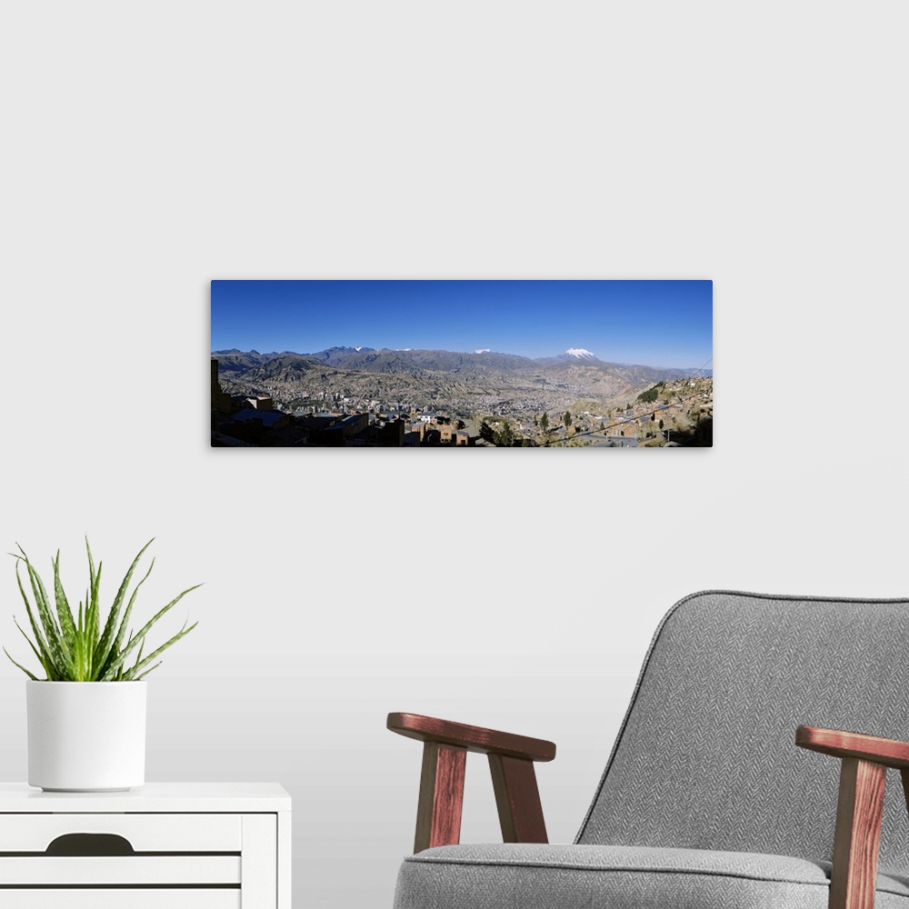 A modern room featuring City with mountains in the background, Mt Illimani, La Paz, Bolivia