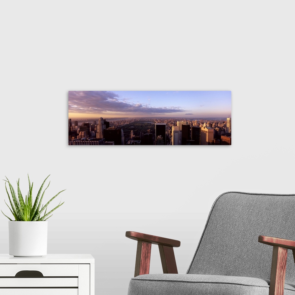 A modern room featuring Cityscape at sunset, Central Park, East Side of Manhattan, New York City, New York State,