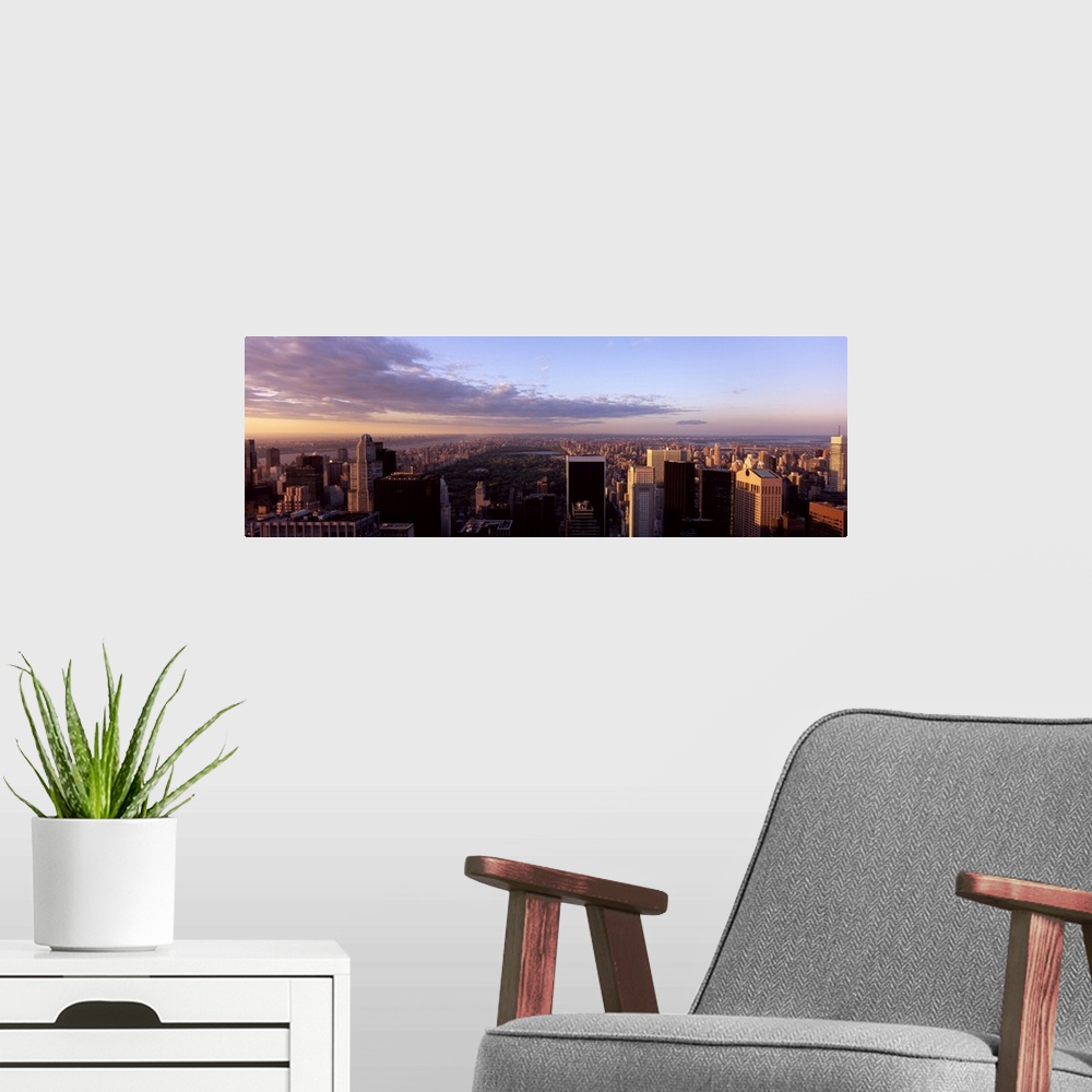 A modern room featuring Cityscape at sunset, Central Park, East Side of Manhattan, New York City, New York State,