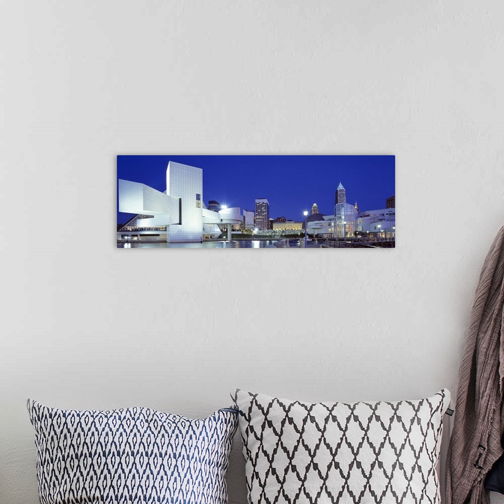 A bohemian room featuring Panoramic photo on canvas of a modern styled building in the foreground and a cityscape in the di...