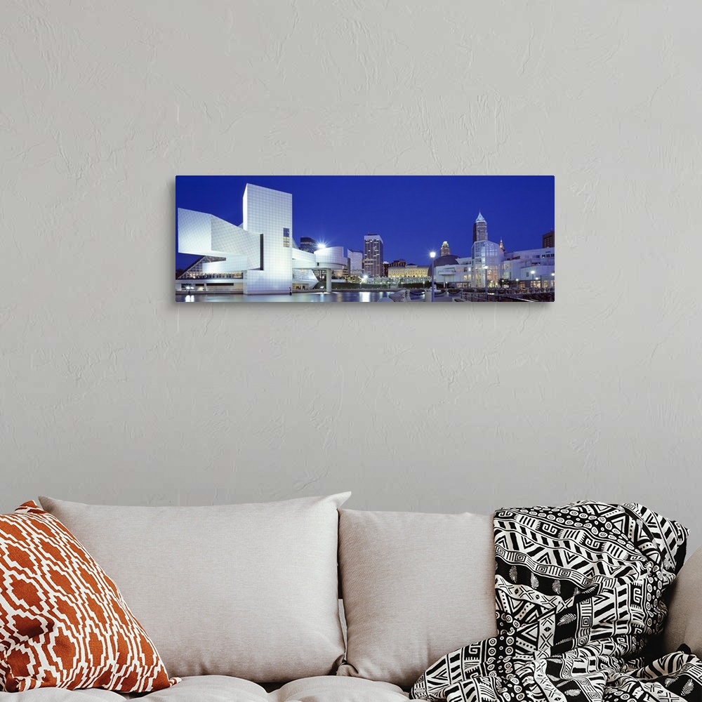 A bohemian room featuring Panoramic photo on canvas of a modern styled building in the foreground and a cityscape in the di...