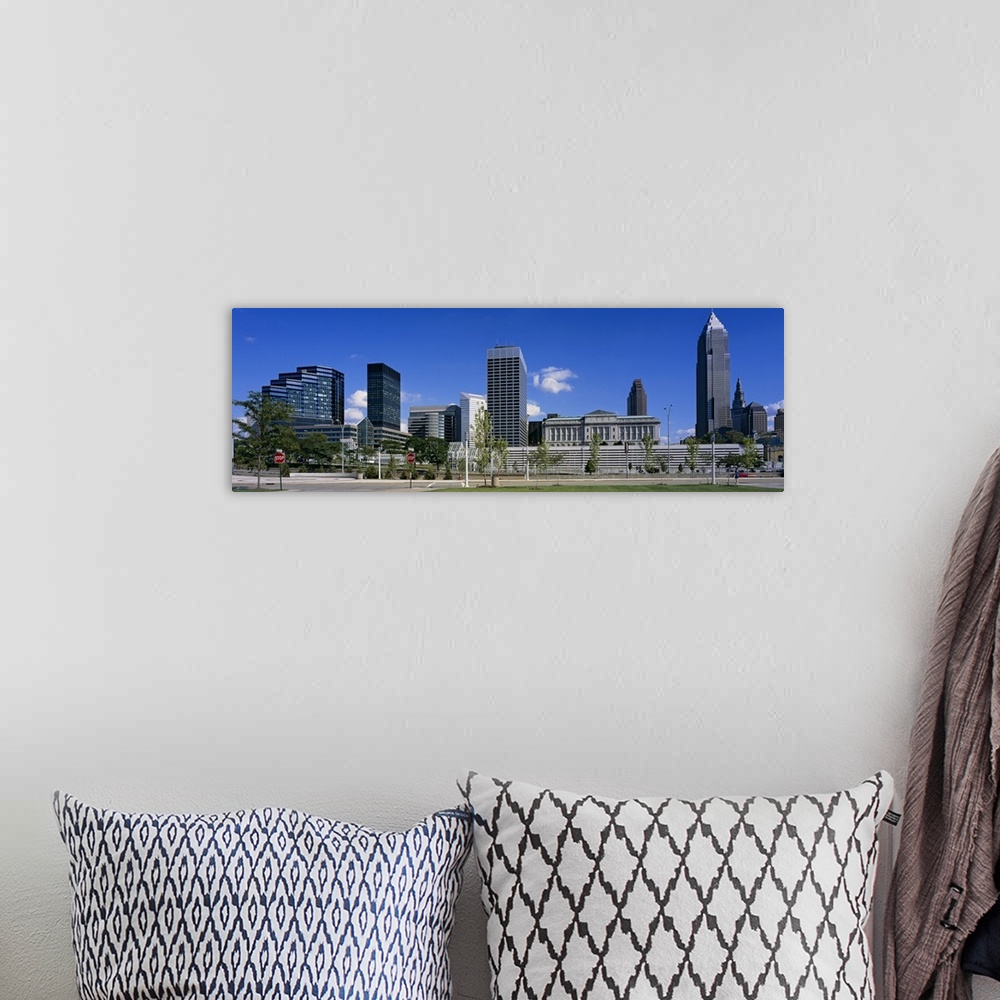 A bohemian room featuring Panoramic photograph taken of the Cleveland skyline on a bright sunny day.