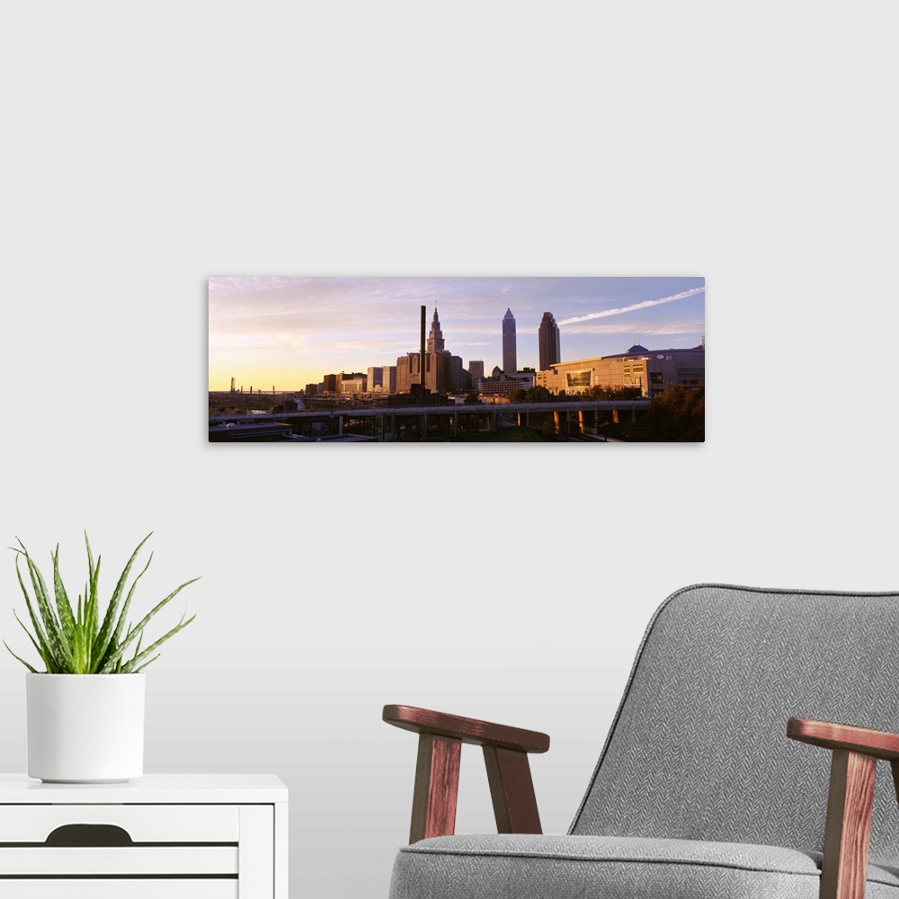 A modern room featuring Cleveland Ohio city skyline at dusk