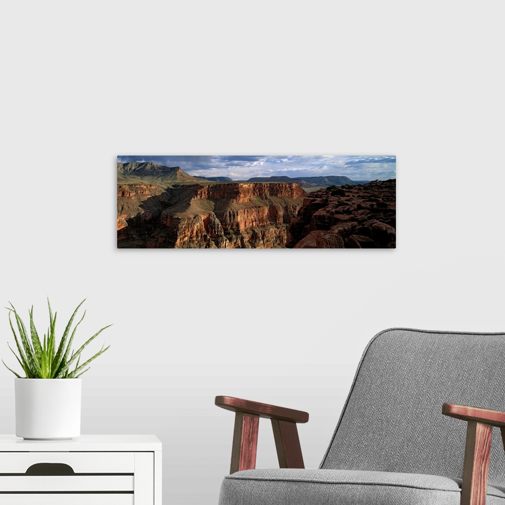 A modern room featuring Landscape of the Grand Canyon National Park in Arizona on a cloudy day.