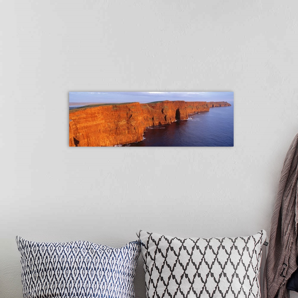 A bohemian room featuring Orange-red cliffside of the Cliffs of Moher County in Clare, Ireland.