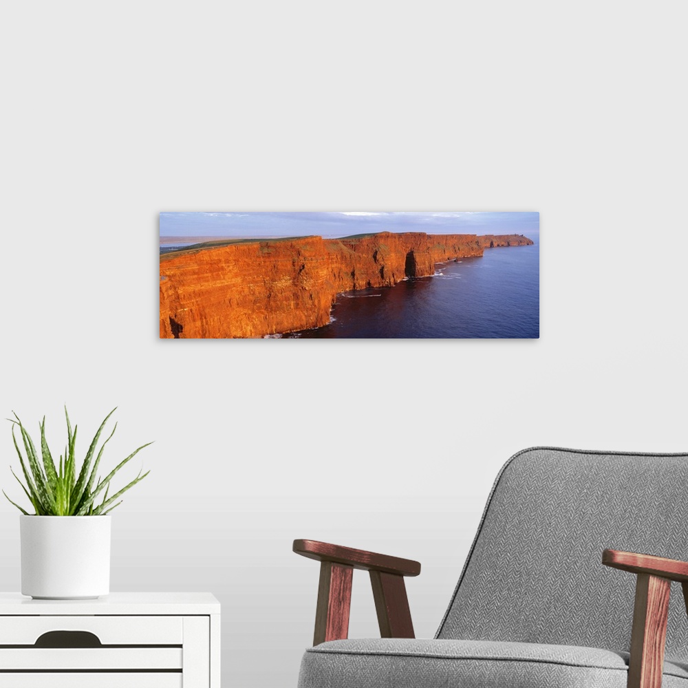A modern room featuring Orange-red cliffside of the Cliffs of Moher County in Clare, Ireland.