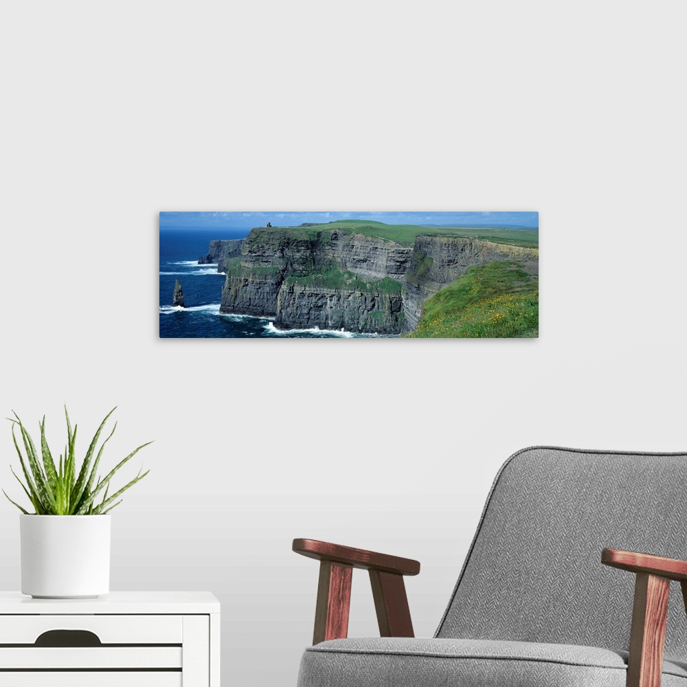 A modern room featuring Panoramic photograph of the Cliffs of Moher County Clare in Ireland on a sunny day.