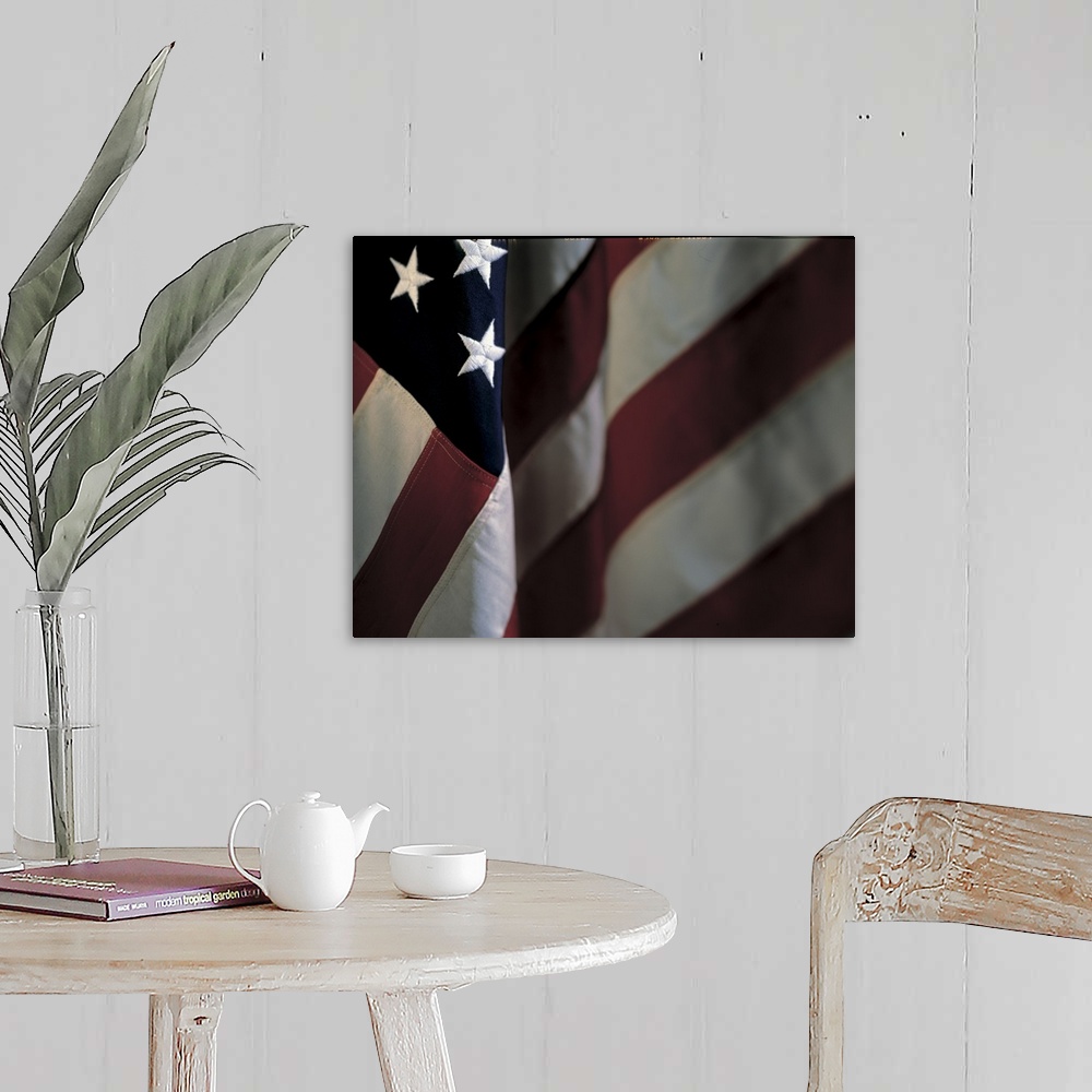 A farmhouse room featuring Oversized, close up landscape photograph of part of the stars and stripes of the American flag.
