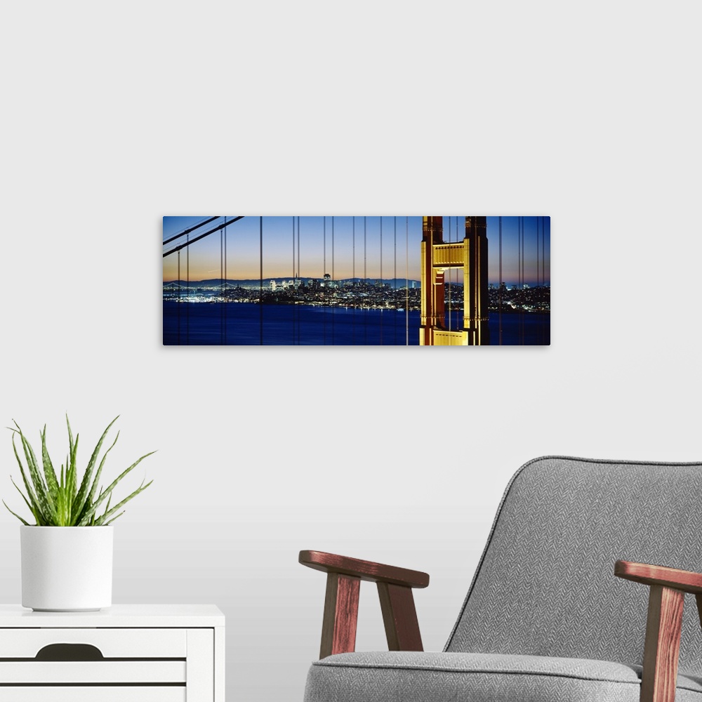 A modern room featuring Close-up of a bridge with a city in the background, Golden Gate Bridge, San Francisco, California
