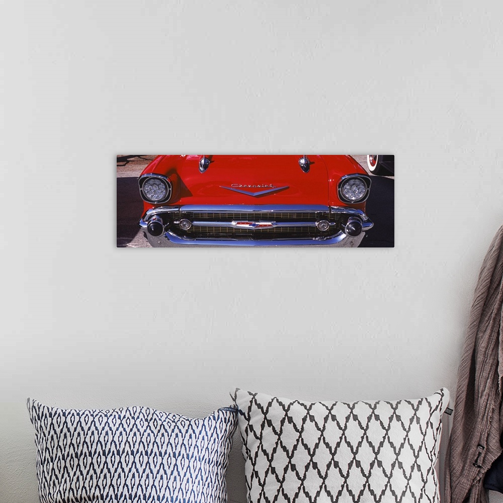 A bohemian room featuring Close-up of a hood ornament of a 57 Chevy car