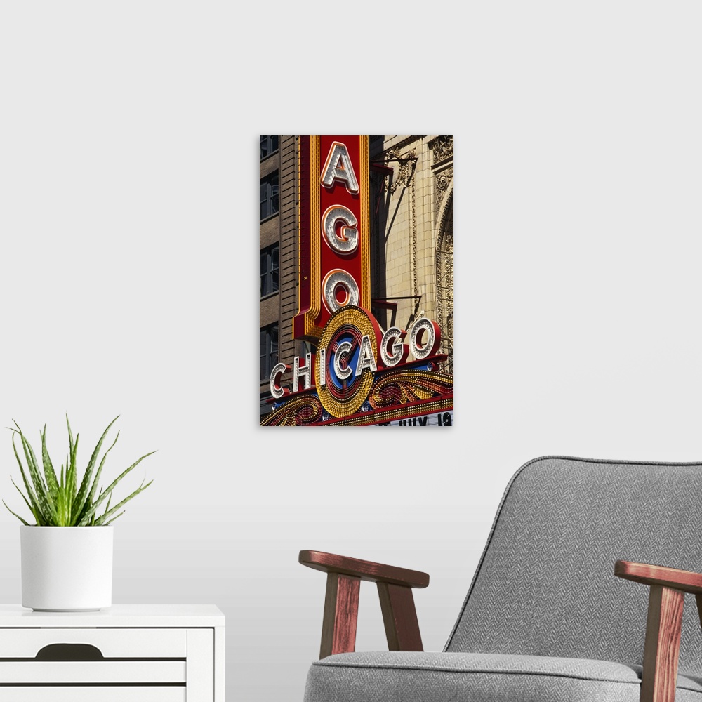 A modern room featuring Vertical photograph of the Chicago Theatre sign in the daytime.