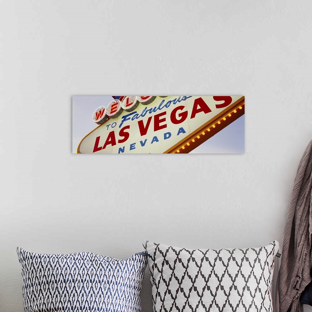 A bohemian room featuring Panoramic photo of a close up of the classic Las Vegas sign.